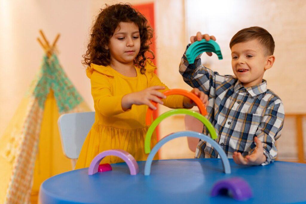 young boy girl playing indoors with eco toys 23 2150268063