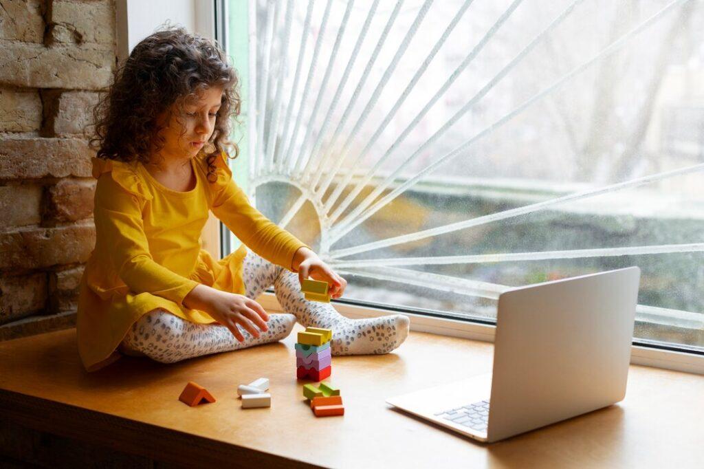 young girl playing indoors with eco toys 23 2150268084