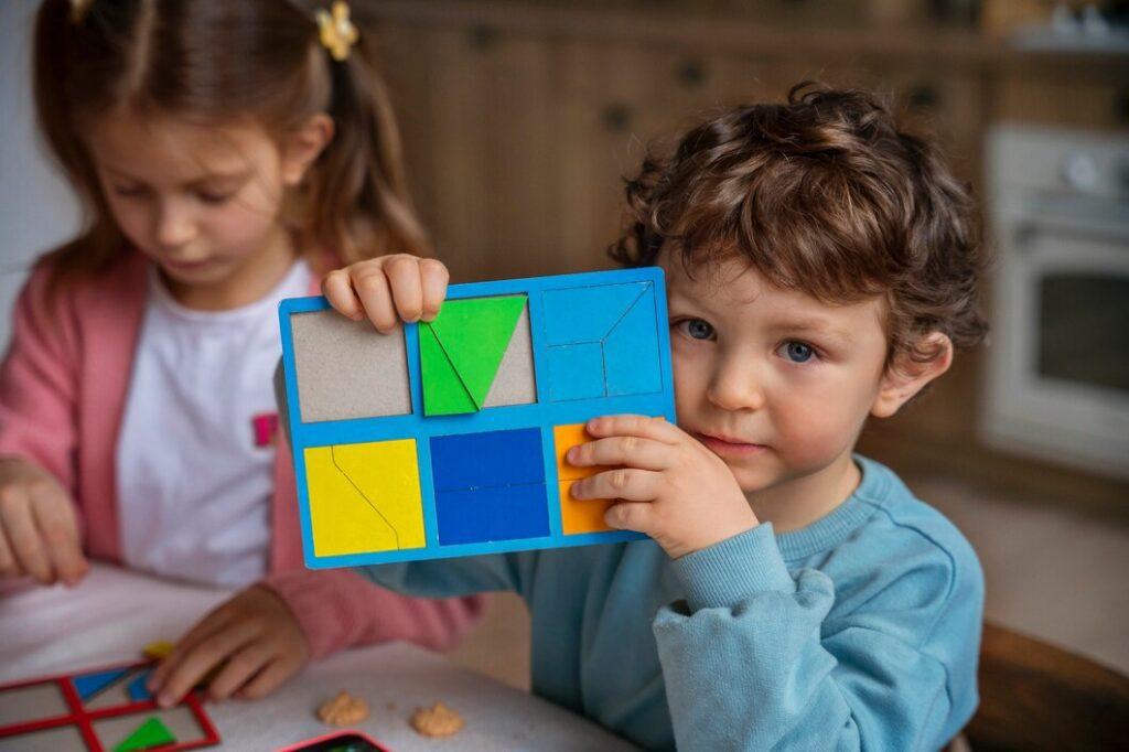 medium shot kids playing memory game 23 2150231784 Shapes Strengthen Early Literacy Skills