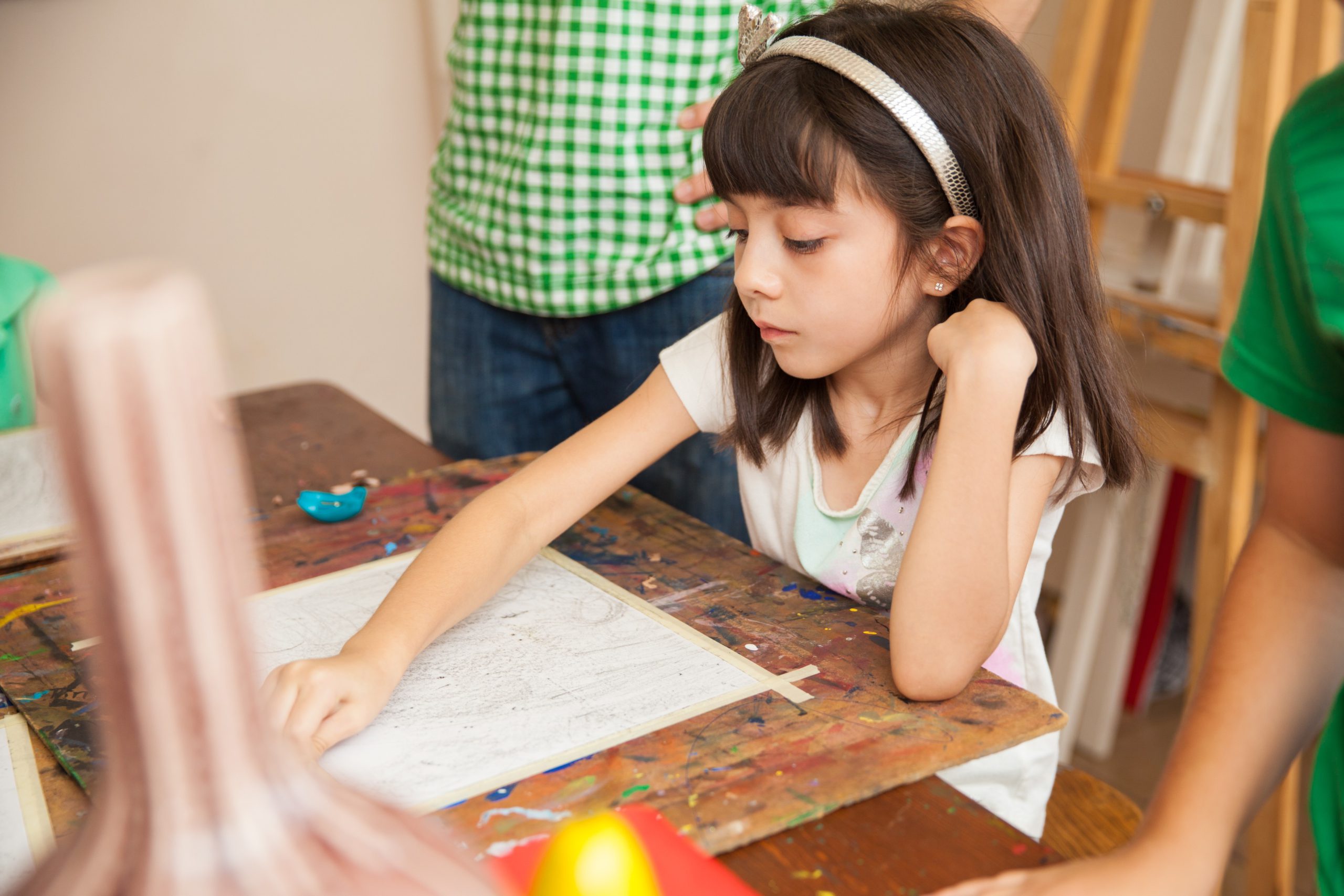 pretty little girl drawing with pencil copying model art class 1 scaled